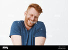 oh-stop-it-you-portrait-of-cute-pleased-and-satisfied-happy-and-funny-redhead-man-in-blue-t-sh...jpg